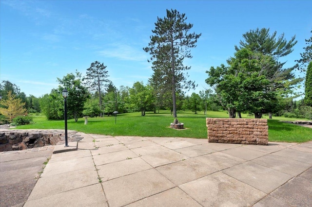 surrounding community featuring a yard and a patio area