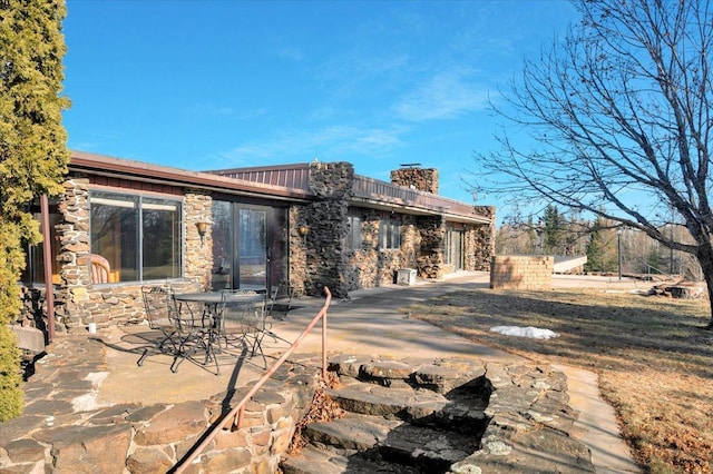 back of house with a patio area