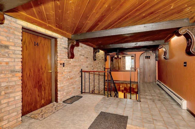 interior space with ceiling fan and a baseboard heating unit