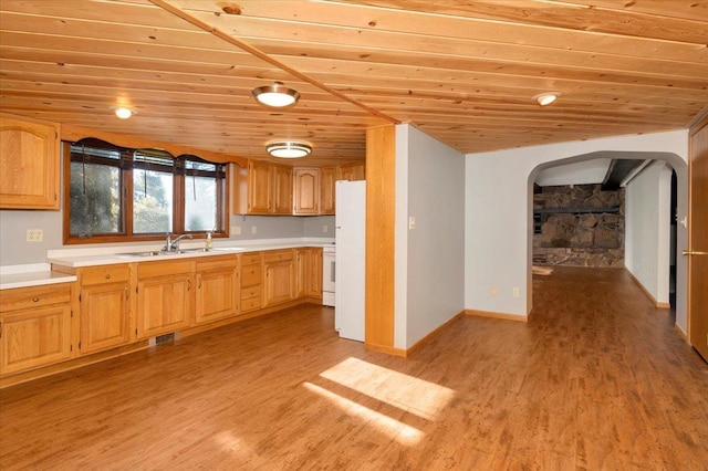 kitchen with sink, wooden ceiling, light hardwood / wood-style floors, and white refrigerator