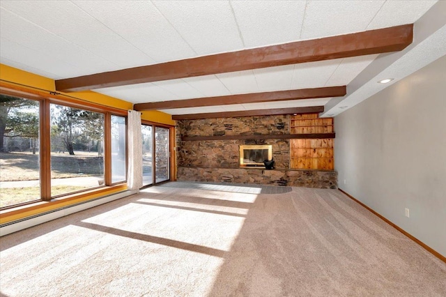 unfurnished living room with baseboard heating, beam ceiling, and carpet