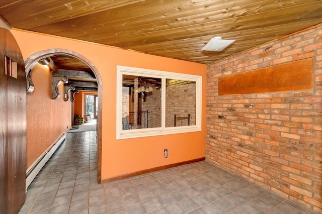 interior space with tile patterned floors, wooden ceiling, brick wall, and baseboard heating