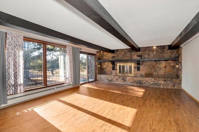 unfurnished living room with wood-type flooring, beamed ceiling, a textured ceiling, and baseboard heating