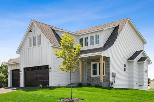 view of front of property with a front lawn and a garage