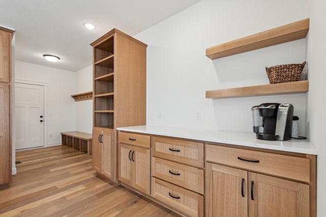 kitchen featuring light brown cabinetry and light hardwood / wood-style flooring