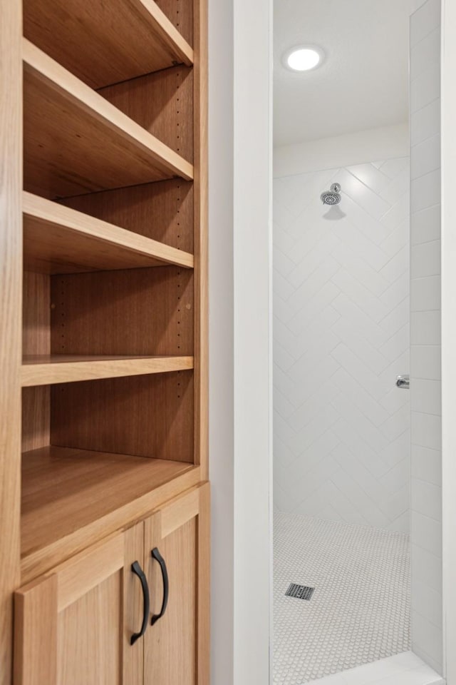 interior space featuring a tile shower