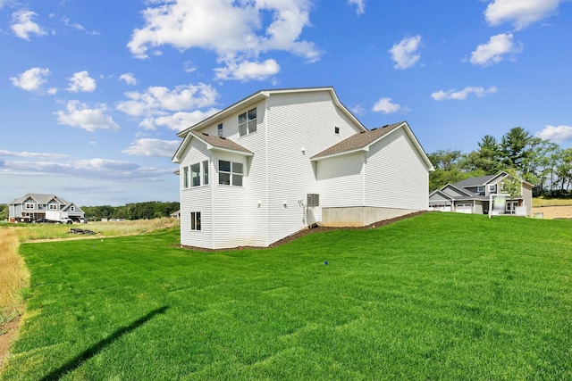 back of house featuring a yard