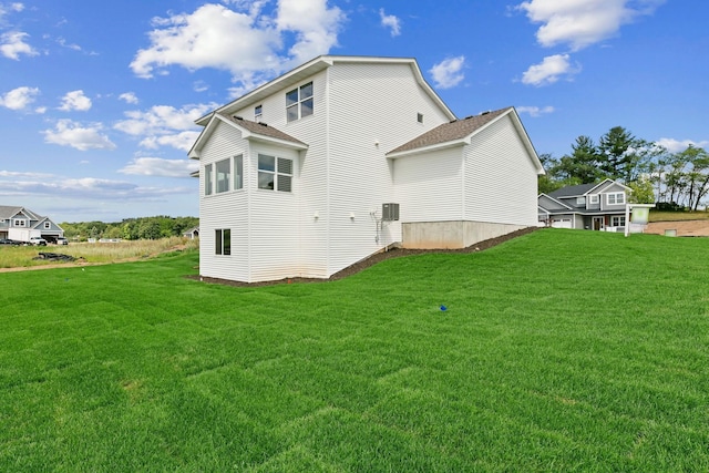 rear view of house with a yard