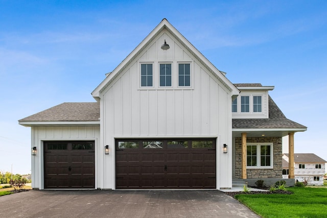 modern farmhouse style home featuring a garage