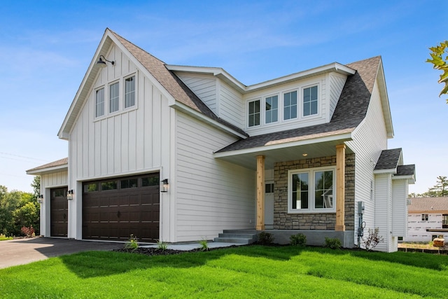 modern farmhouse style home with covered porch, a front lawn, and a garage