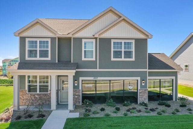 craftsman-style home with a front yard