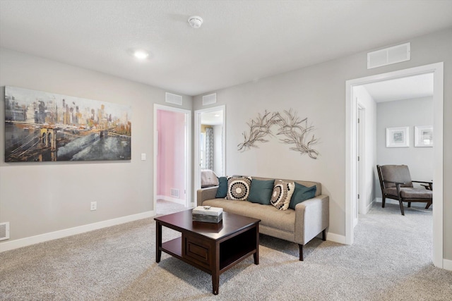 living room with light colored carpet