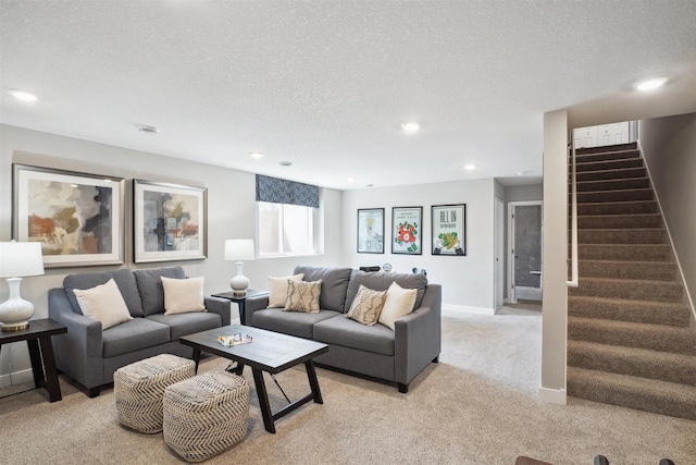 carpeted living room with a textured ceiling