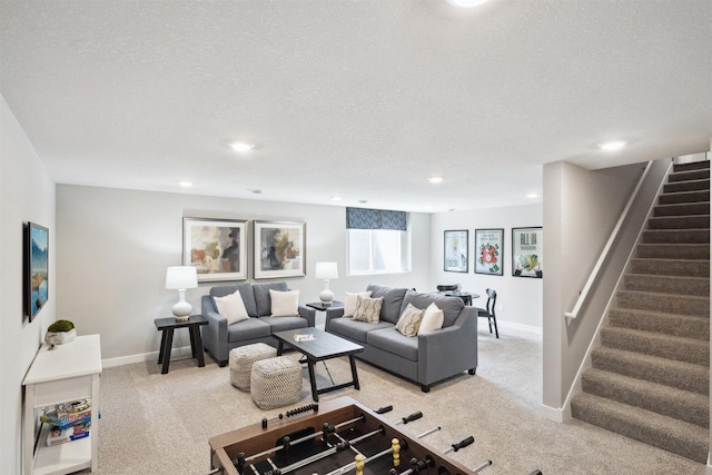 carpeted living room featuring a textured ceiling