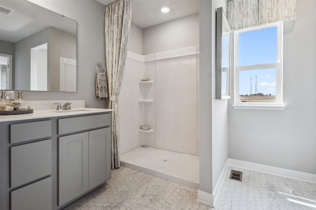 bathroom featuring vanity and walk in shower