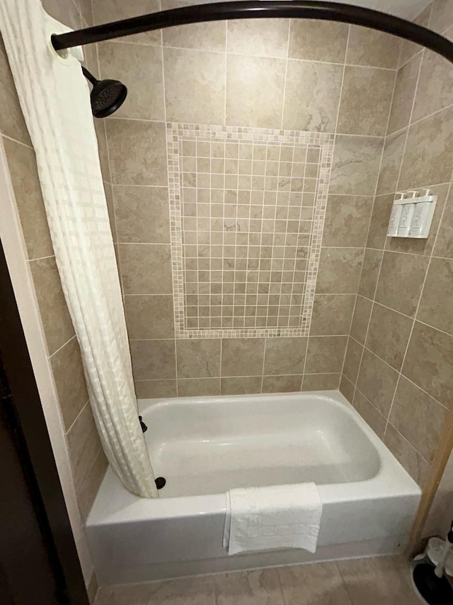 bathroom with shower / bathtub combination with curtain