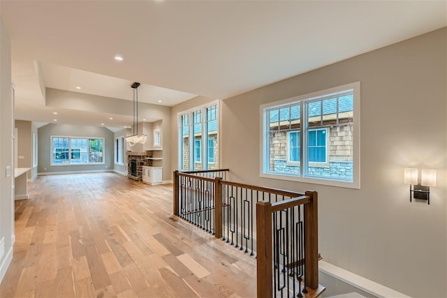 hallway with light hardwood / wood-style flooring