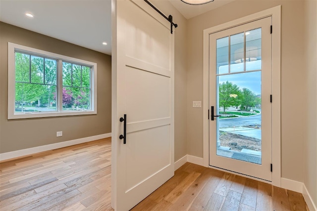 doorway featuring light hardwood / wood-style flooring and a barn door