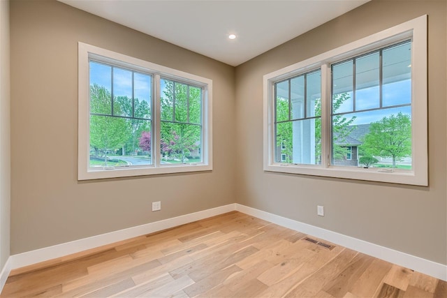 empty room with light wood-type flooring