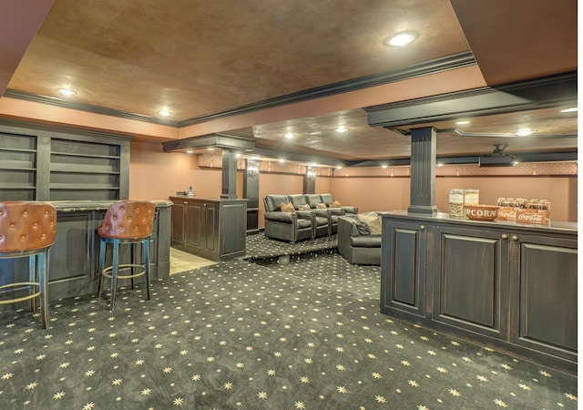 interior space with ornamental molding, decorative columns, and carpet flooring