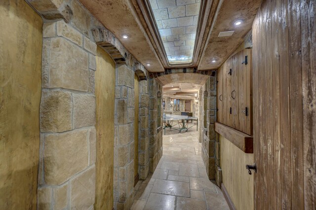 hall featuring light tile patterned floors