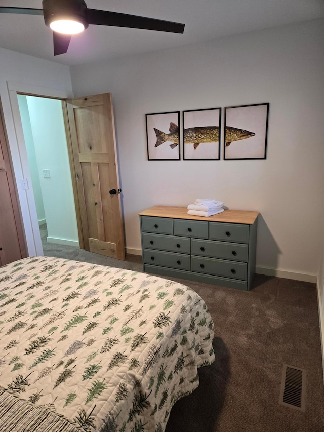 bedroom featuring dark colored carpet and ceiling fan