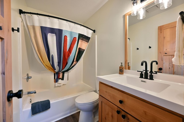 full bathroom featuring hardwood / wood-style flooring, vanity, shower / bath combination with curtain, and toilet