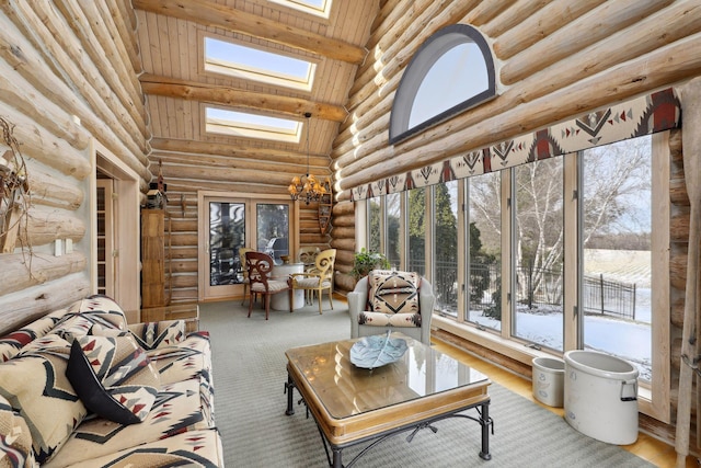 sunroom featuring vaulted ceiling with skylight