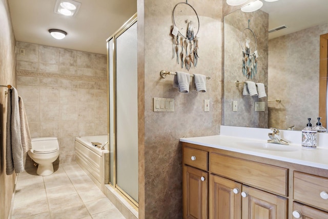 full bathroom featuring independent shower and bath, tile walls, vanity, tile patterned flooring, and toilet