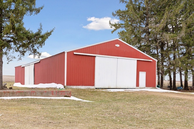 view of outbuilding with a yard