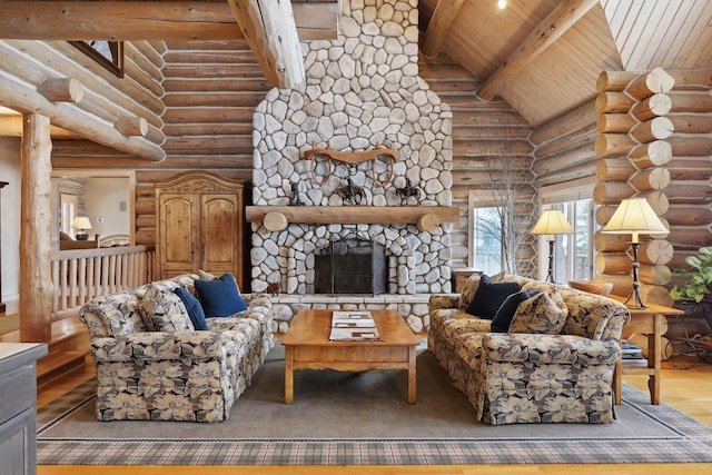 living room with beamed ceiling, wooden ceiling, hardwood / wood-style flooring, a fireplace, and high vaulted ceiling