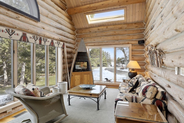 sunroom featuring lofted ceiling with skylight and wooden ceiling