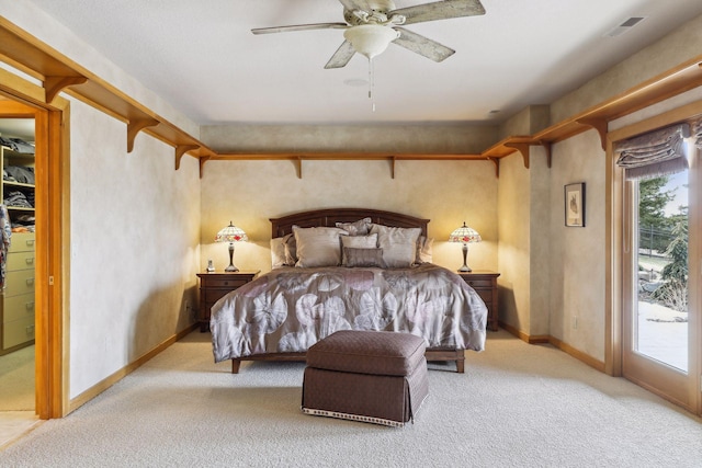 carpeted bedroom with ceiling fan and access to outside