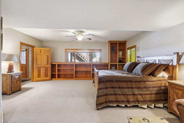 bedroom with ceiling fan and light colored carpet