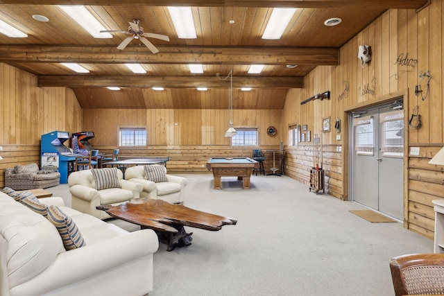 living room with a healthy amount of sunlight, vaulted ceiling with beams, and wooden ceiling