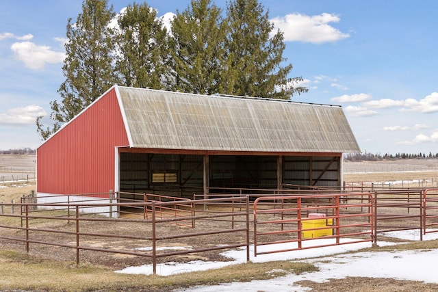 view of horse barn featuring a rural view