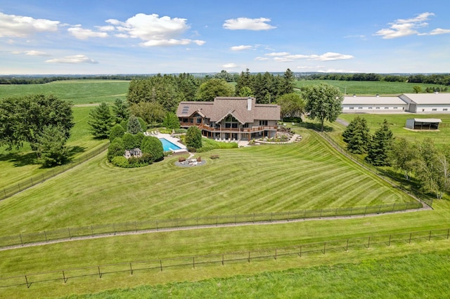 birds eye view of property with a rural view