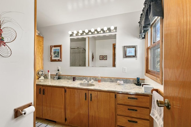 bathroom featuring wood-type flooring, vanity, and a wealth of natural light