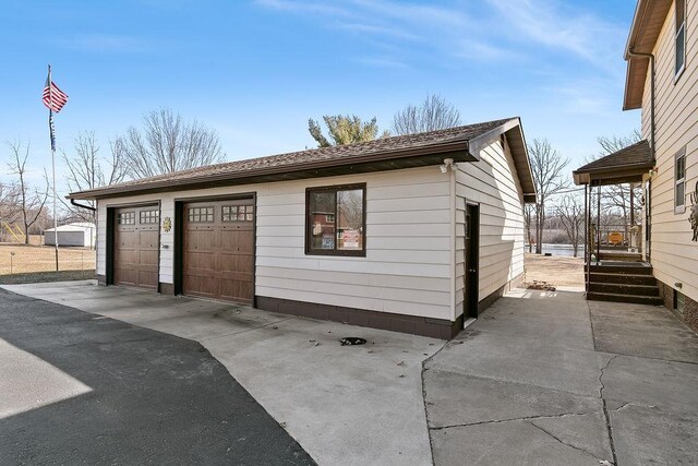 garage featuring wooden walls