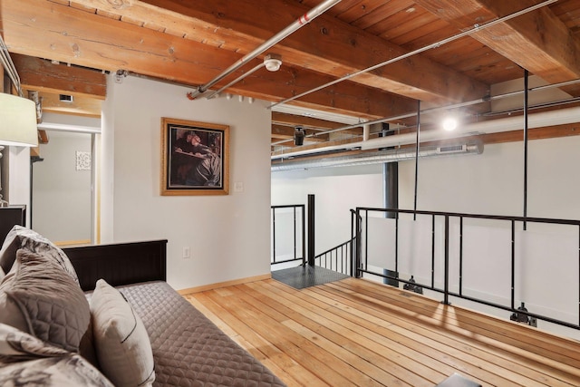 interior space featuring light hardwood / wood-style floors and wood ceiling