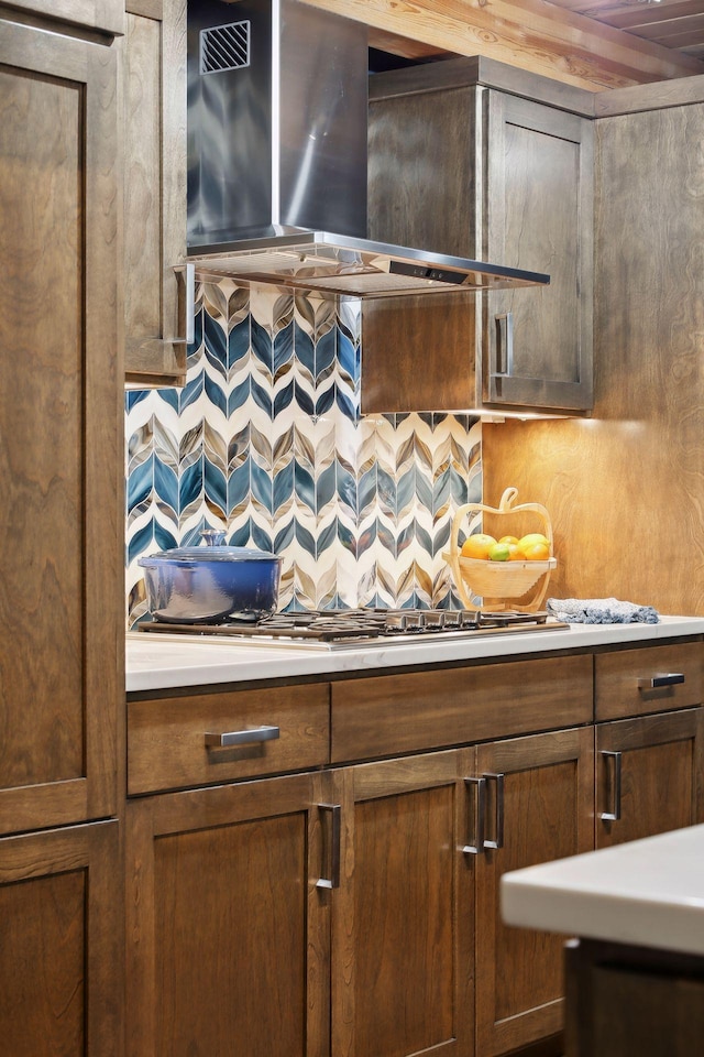 kitchen with tasteful backsplash and wall chimney exhaust hood