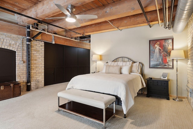 carpeted bedroom featuring brick wall, wooden ceiling, ceiling fan, and beamed ceiling