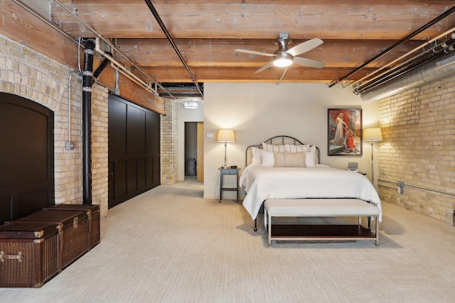 carpeted bedroom featuring wooden ceiling, ceiling fan, and brick wall