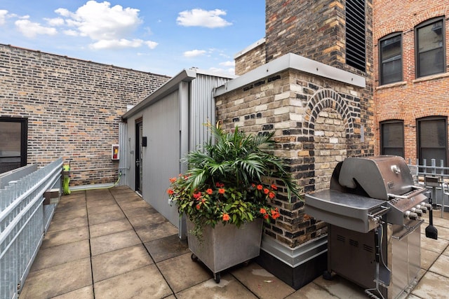 view of patio featuring a grill