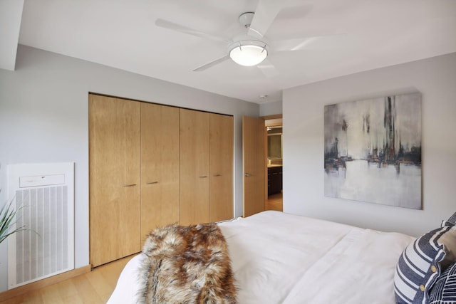 bedroom featuring light hardwood / wood-style flooring and ceiling fan