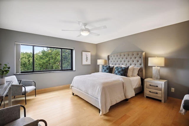 bedroom with light wood-type flooring and ceiling fan