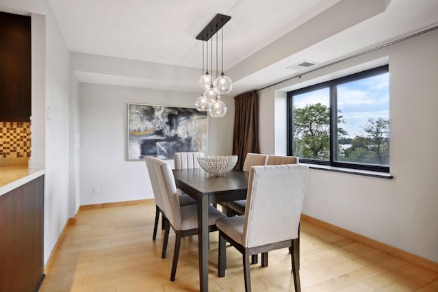 dining area featuring light wood-type flooring