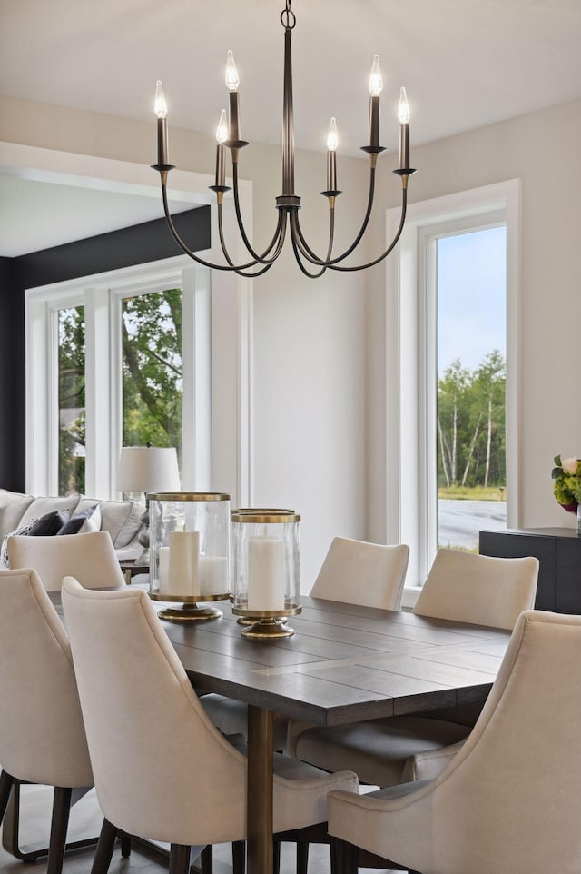 dining room with a notable chandelier and plenty of natural light