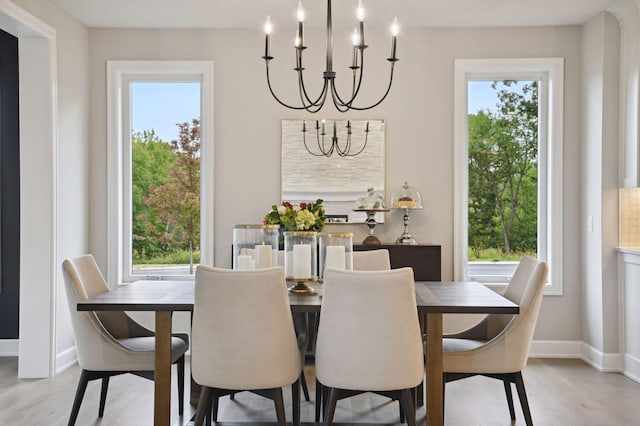 dining area with an inviting chandelier and a healthy amount of sunlight