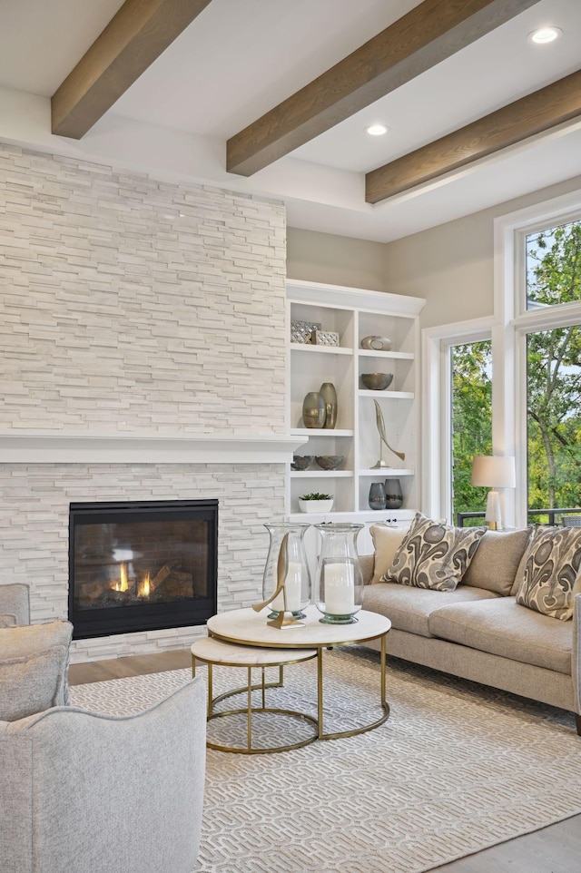 living room featuring a fireplace and beam ceiling